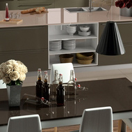 Modern Kitchen Table next to a Gray Island with Beige Quartz Countertops