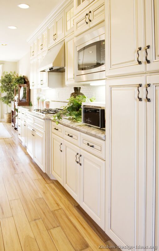 White Kitchen Cabinets with Light Wood Floors