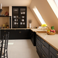 A Traditional Black Kitchen with Low Vaulted Ceilings and Beige Compac Quartz Countertops