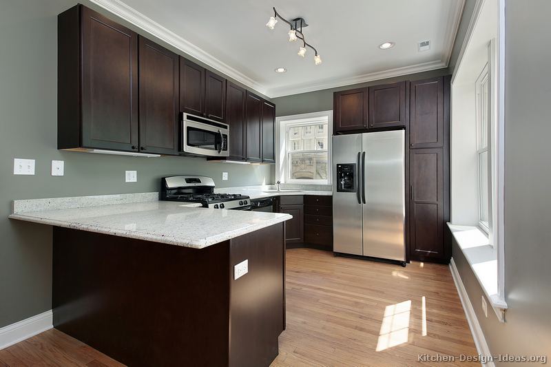 dark kitchen cabinets with mild countertops