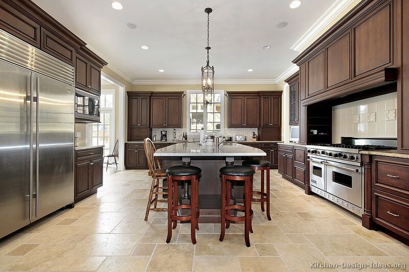 A Large Luxury Kitchen Design With Dark Walnut Stained Cabinets