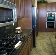 Traditional Dark Wood-Walnut Kitchen