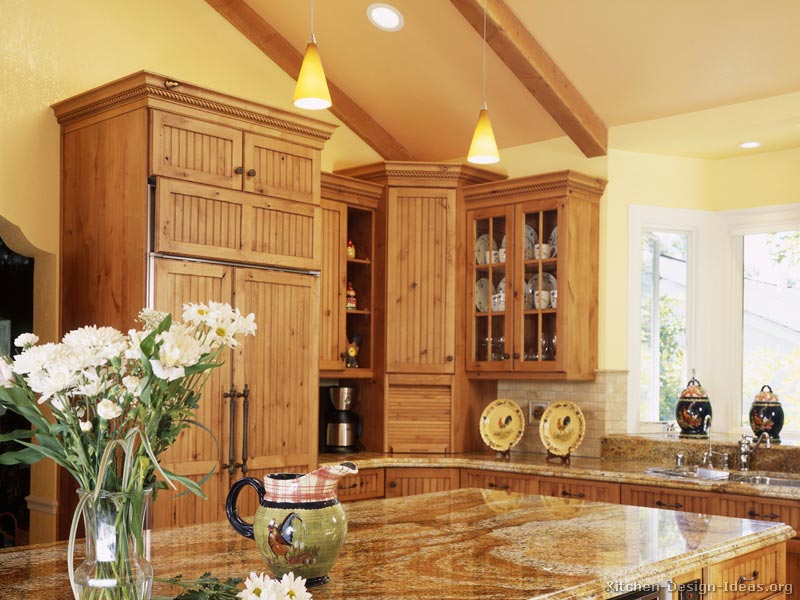 A Beautiful Country Kitchen with a Wood Paneled Refrigerator
