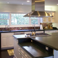 Luxury White Kitchen with a Bi-Level Island and Pearlescent Tile Backsplash - Designer Kitchens LA